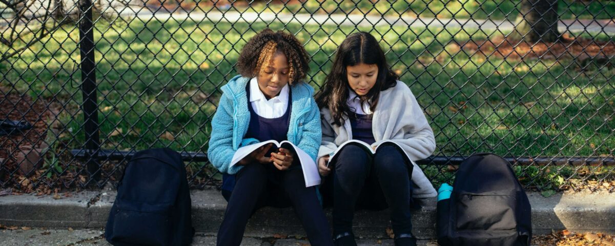 2 students reading notes